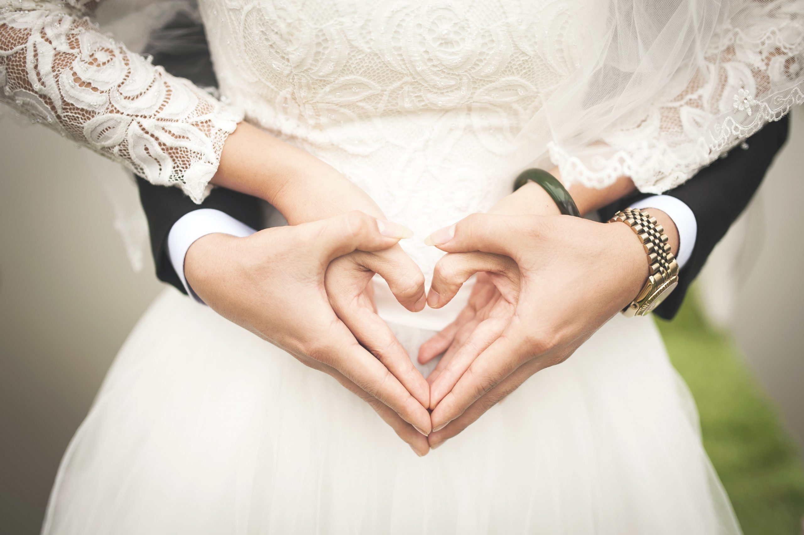 midsection-of-woman-making-heart-shape-with-hands-256737 (1)